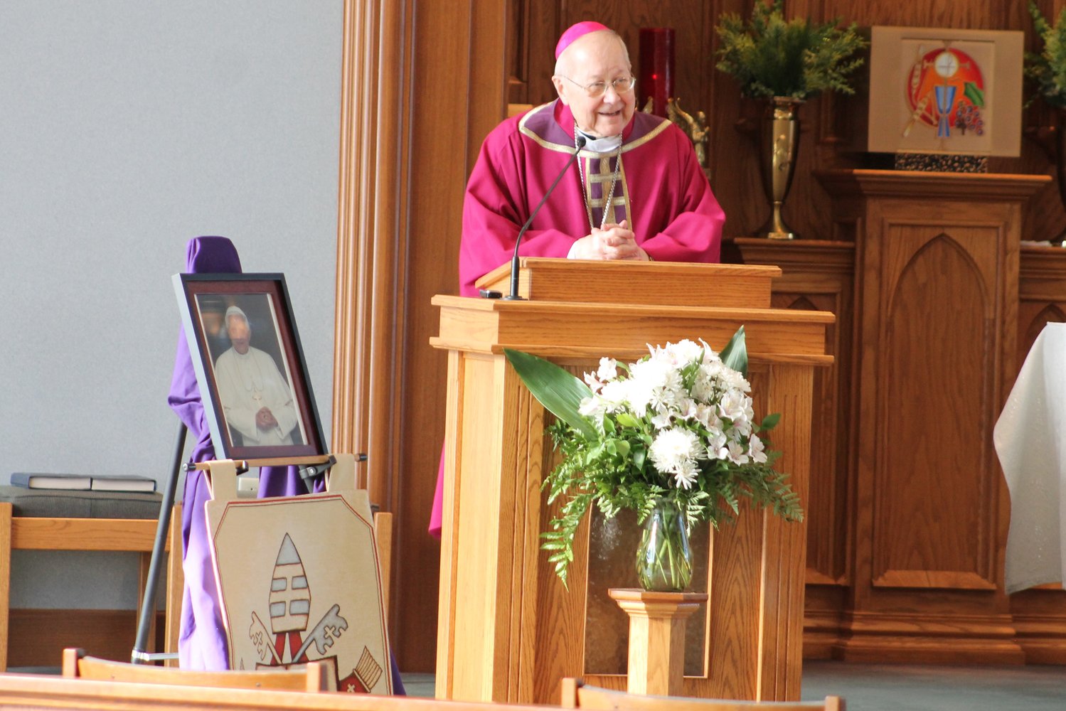 Bishop Emeritus John R. Gaydos, who led the Jefferson City diocese from 1997 to 2018, preaches the homily during the See City Deanery’s Memorial Mass for Pope Emeritus Benedict XVI on Jan. 6 in St. Andrew Church in Holts Summit.